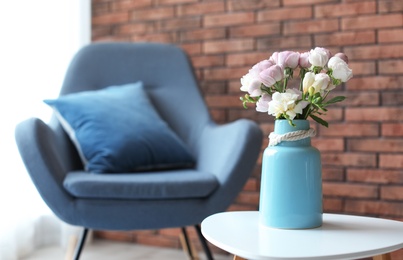 Vase with beautiful flowers on table indoors. Interior decor element