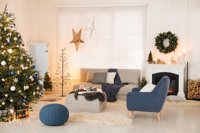 Photo of Cozy living room interior with beautiful Christmas tree and comfortable furniture