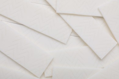 Photo of Sticks of white chewing gum as background, top view