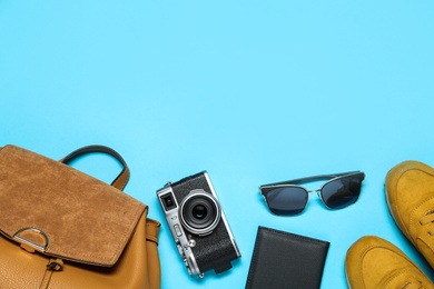 Photo of Flat lay composition with stylish women's backpack on light blue background. Space for text