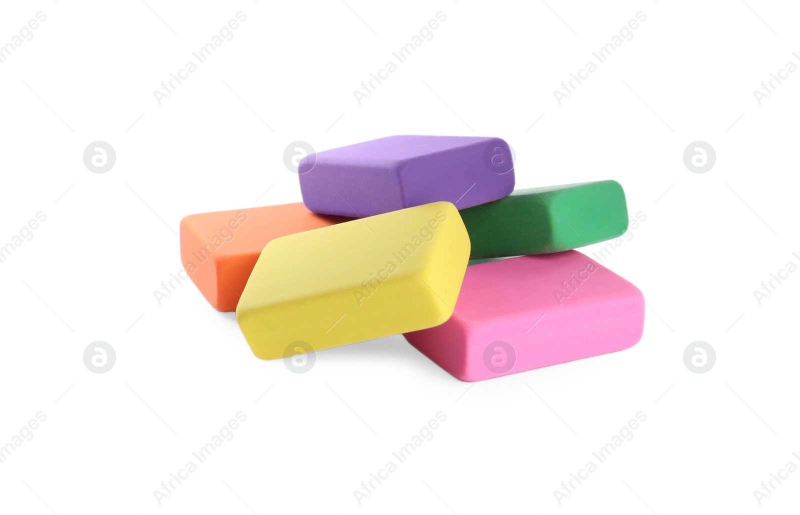 Photo of Pile of bright erasers on white background