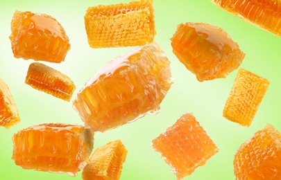 Image of Pieces of honeycomb falling on light green background