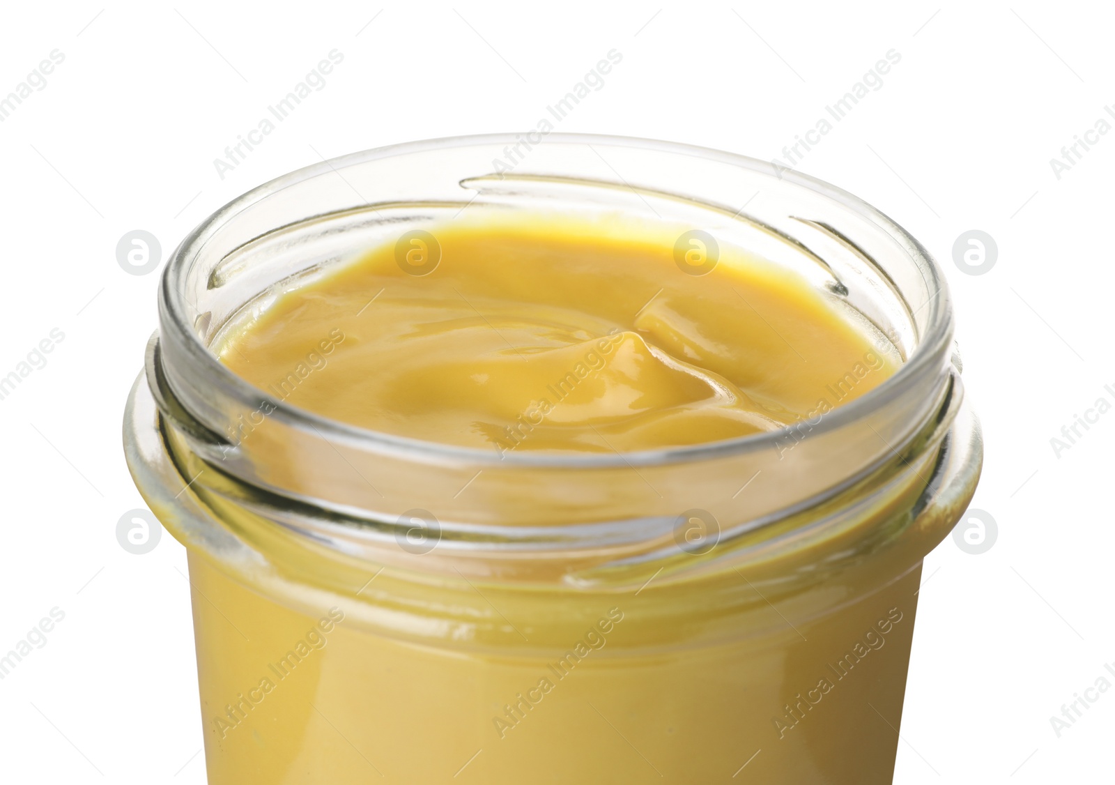 Photo of Glass jar of delicious mustard isolated on white, closeup