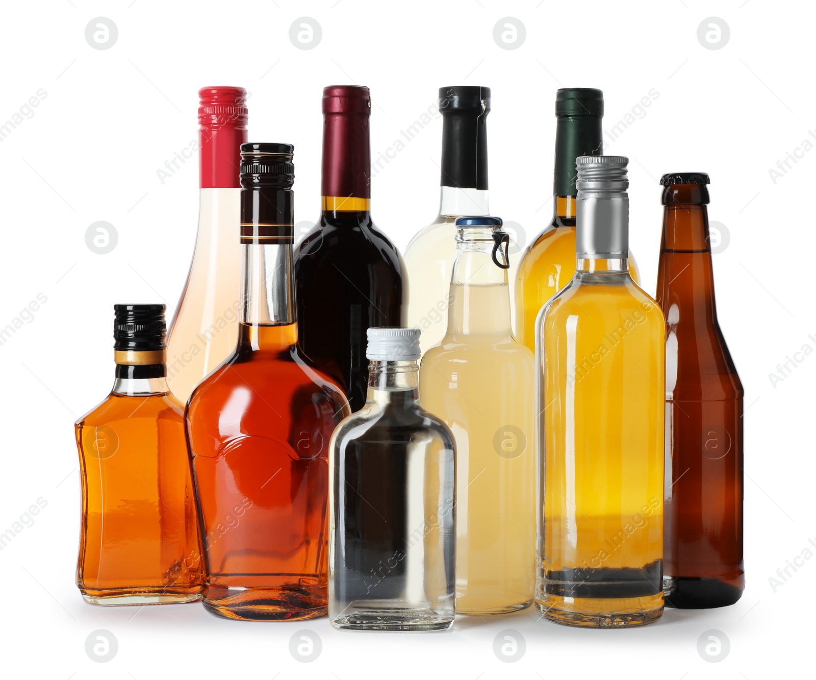 Photo of Bottles with different alcoholic drinks on white background