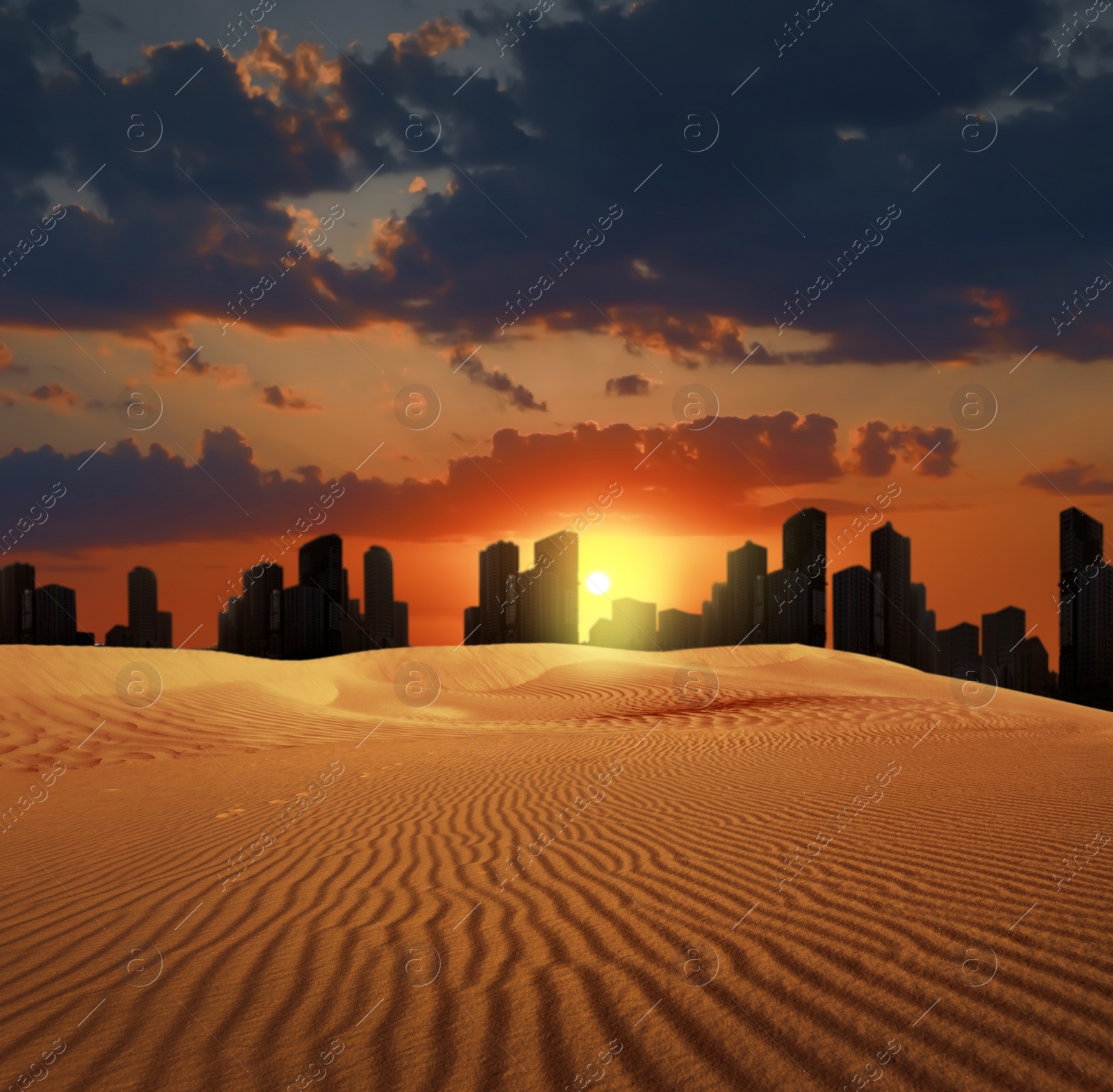 Image of Sandy desert and silhouette of city on horizon at sunset