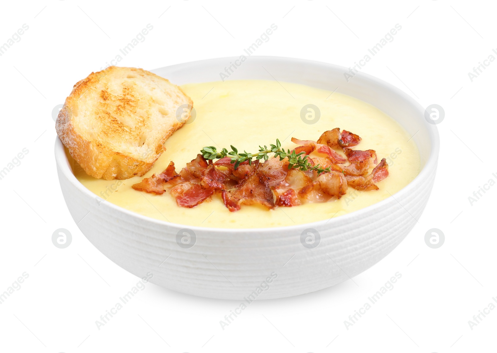 Photo of Tasty potato soup with bacon and crouton in bowl isolated on white