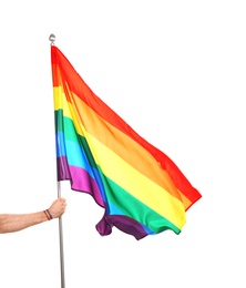 Photo of Gay man holding rainbow LGBT flag on white background