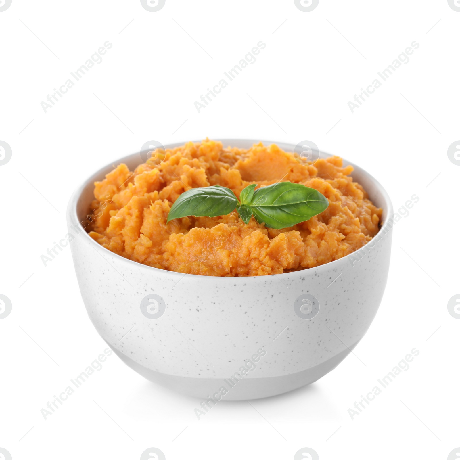 Photo of Bowl with mashed sweet potatoes on white background