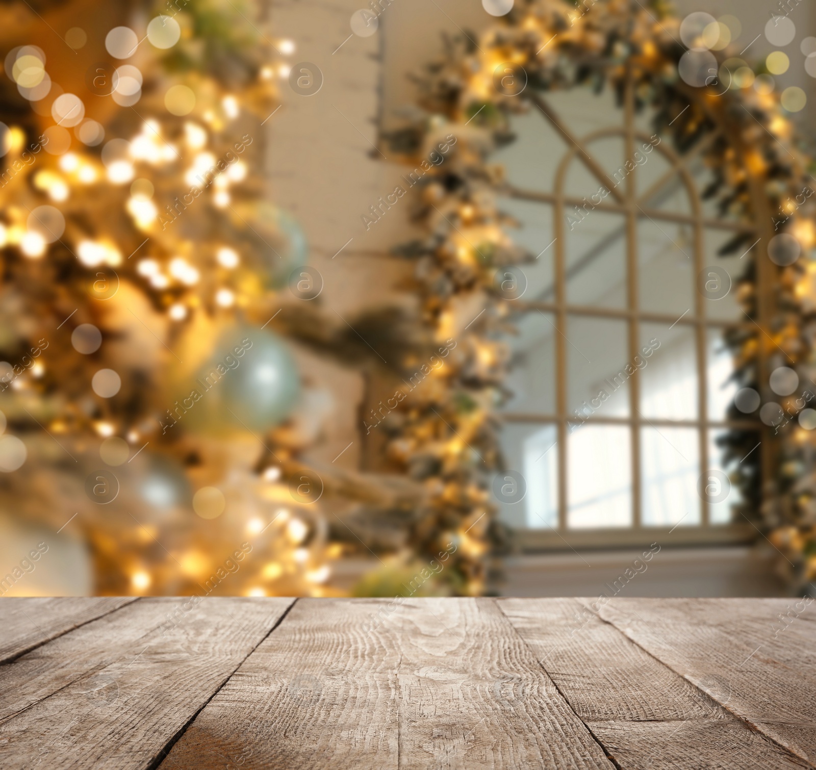 Image of Empty wooden surface and blurred view of room decorated for Christmas