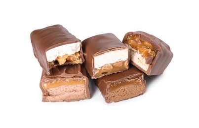 Photo of Pieces of tasty chocolate bars with nougat and nuts on white background