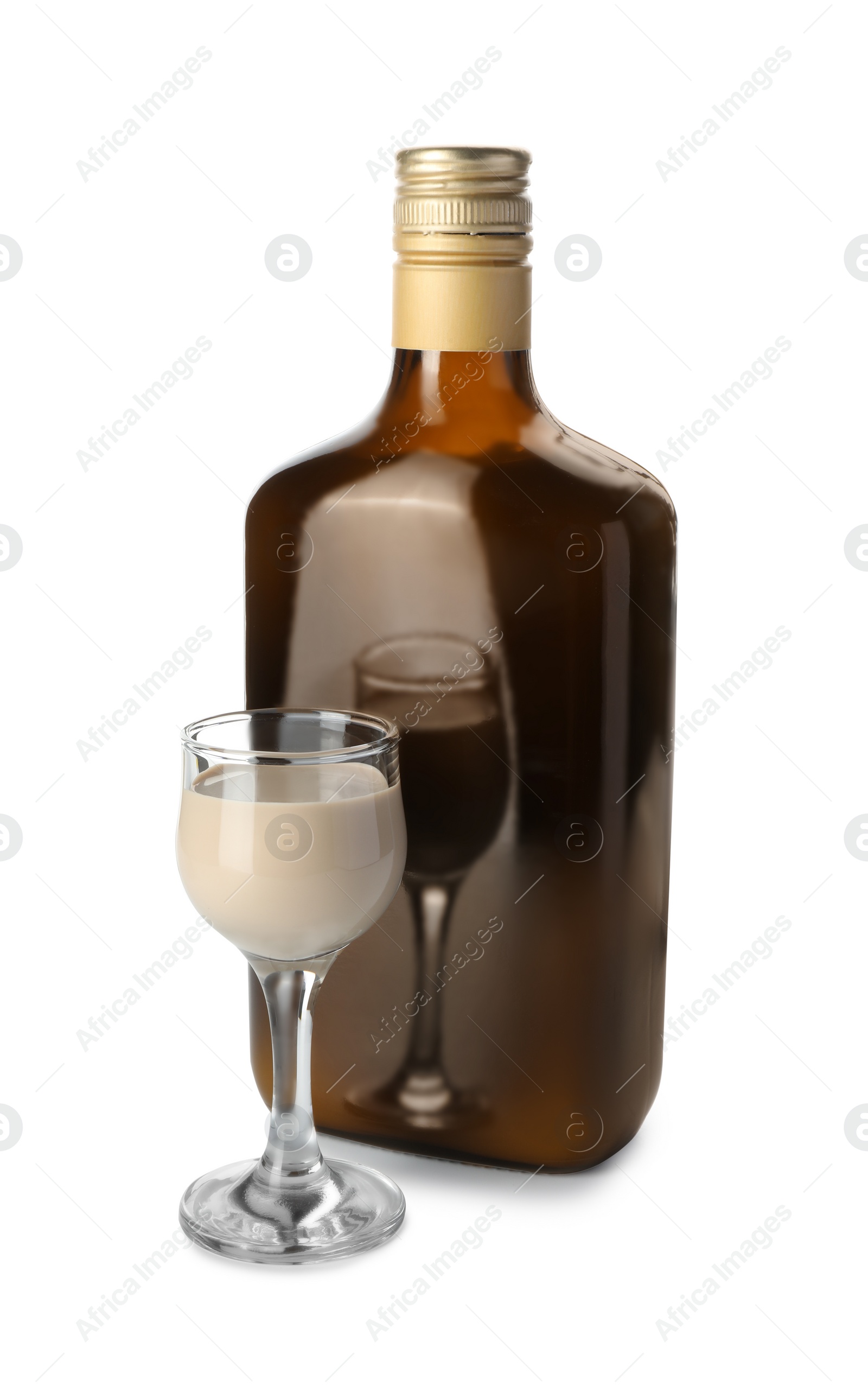 Photo of Bottle and glass of coffee cream liqueur isolated on white