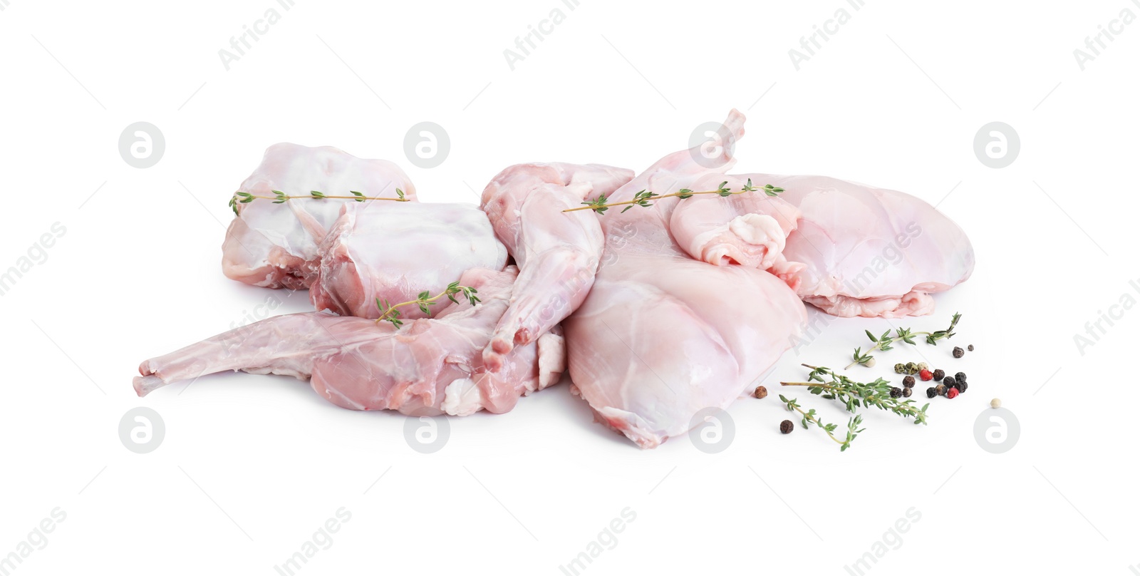 Photo of Fresh raw rabbit meat and spices isolated on white