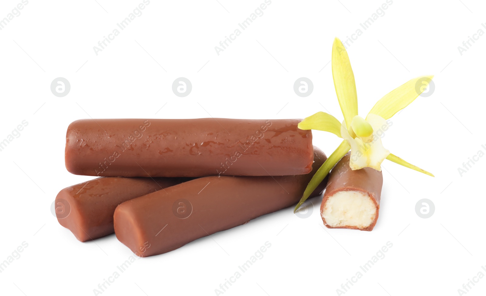 Photo of Glazed curd cheese bars and vanilla flower isolated on white