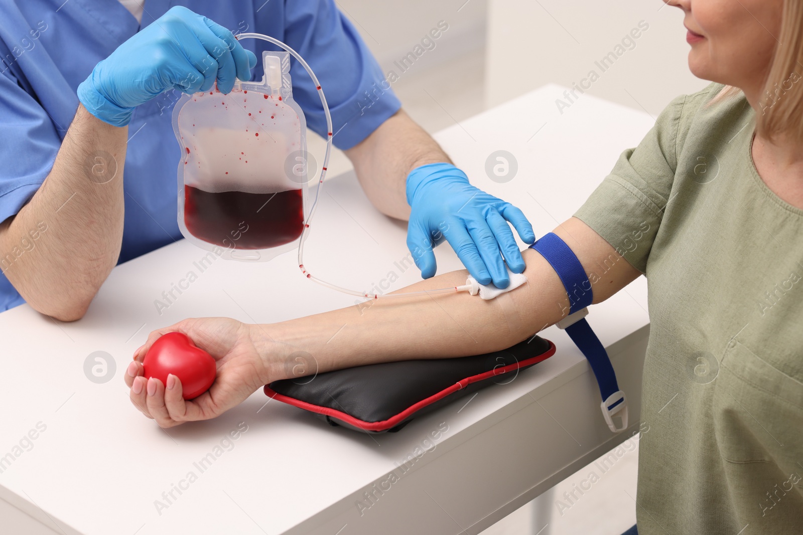 Photo of Patient undergoing blood transfusion in hospital, closeup