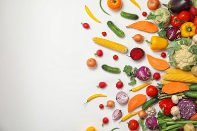 Photo of Flat lay composition with fresh vegetables and space for text on white background