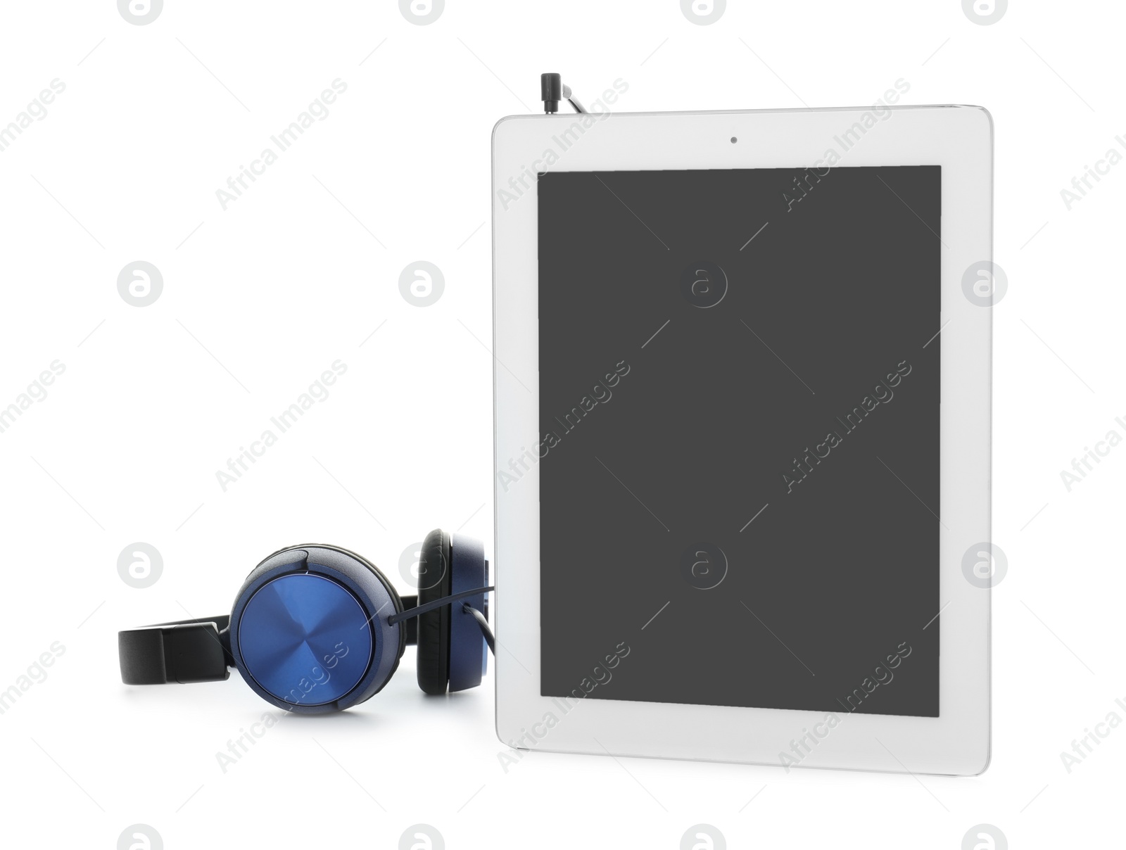 Photo of Tablet with blank screen and headphones on white background