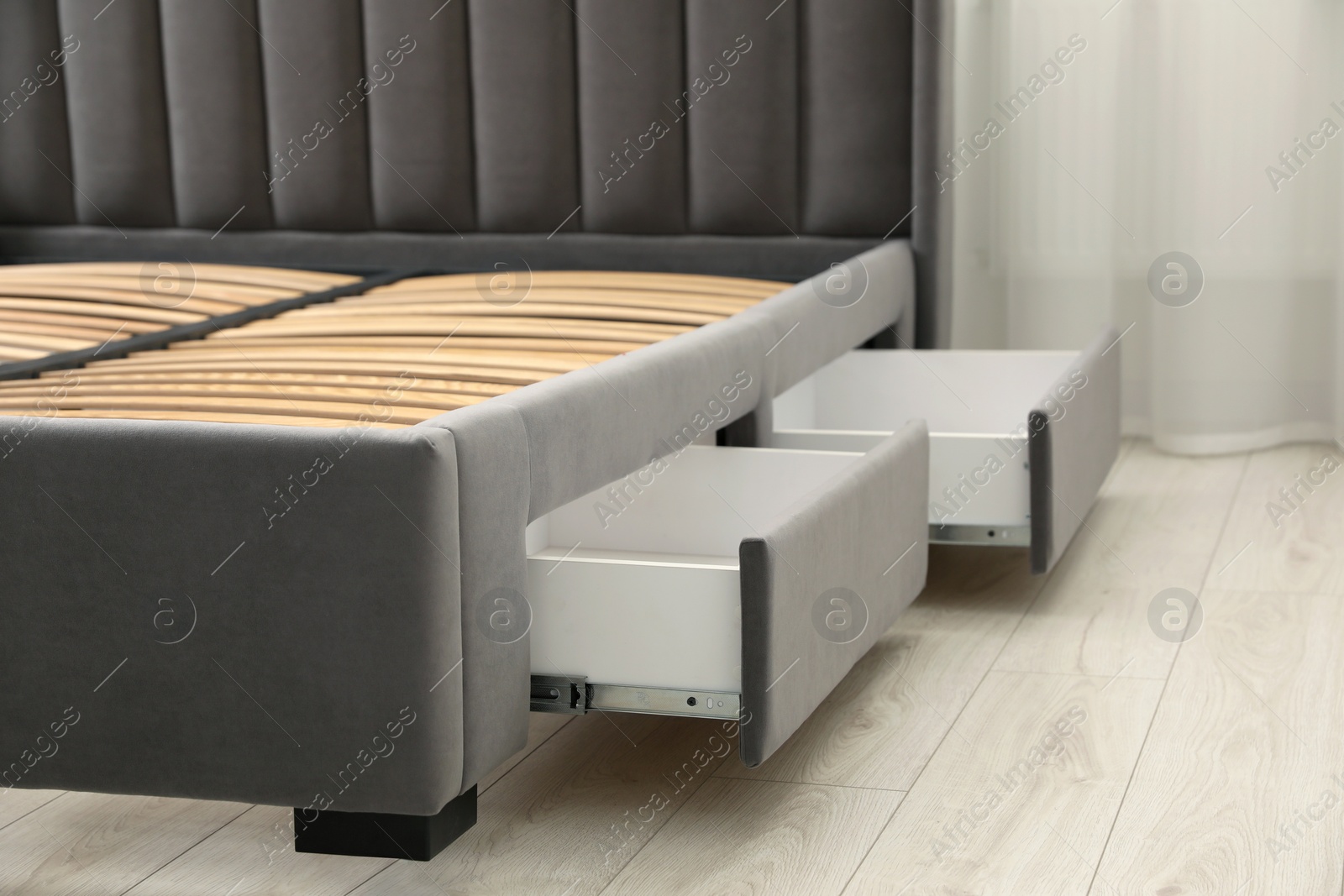 Photo of Storage drawers for bedding under modern bed in room