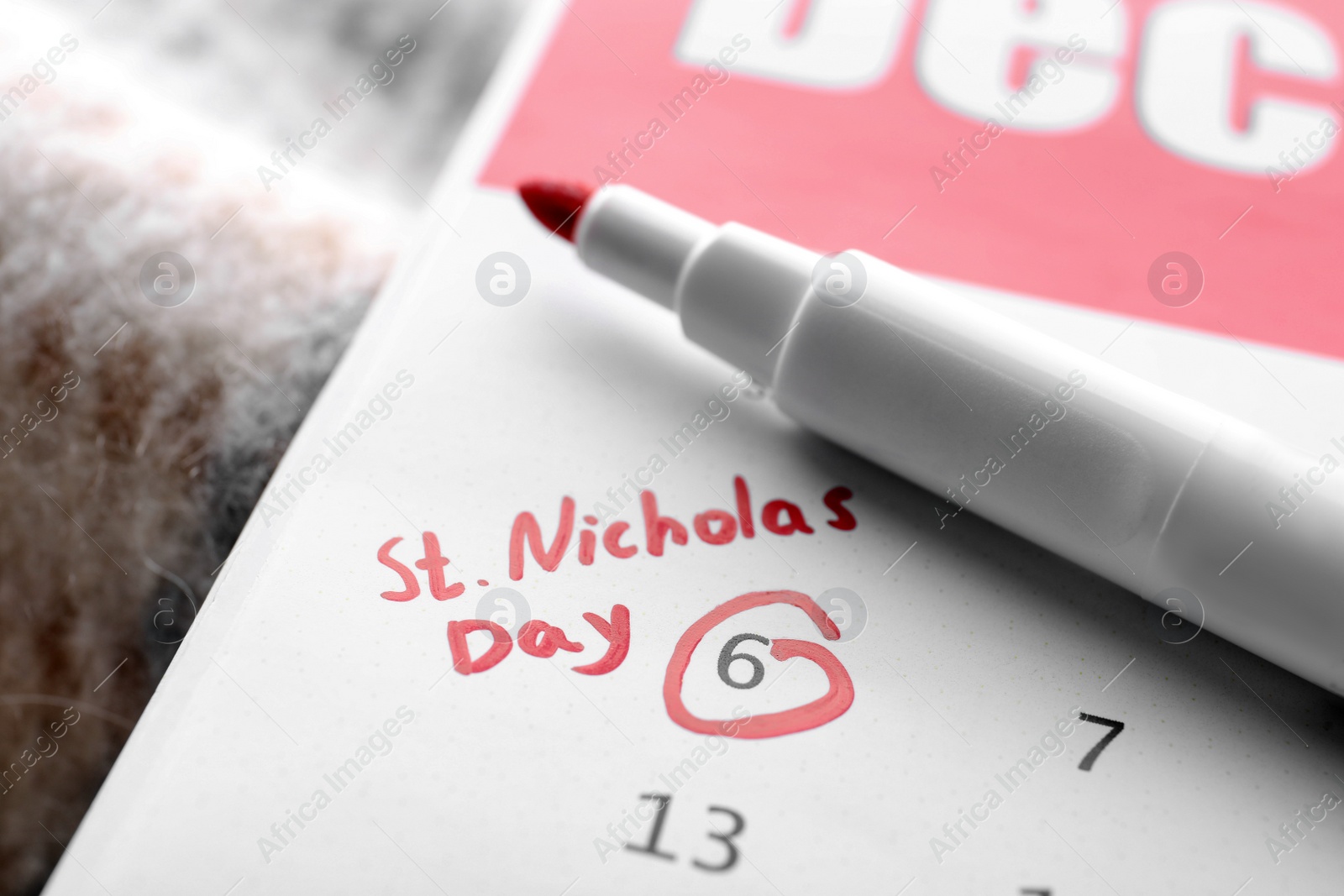 Photo of Saint Nicholas Day. Calendar with marked date December 06 and marker, closeup