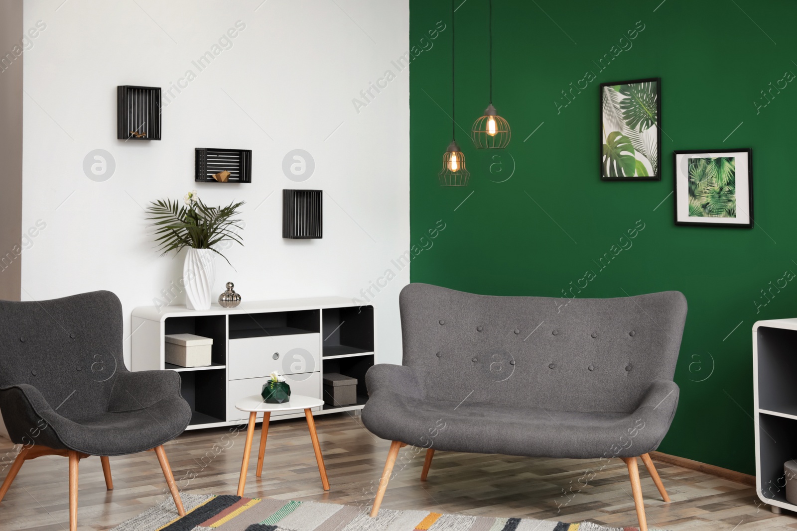 Photo of Modern living room interior stylish sofa near green wall