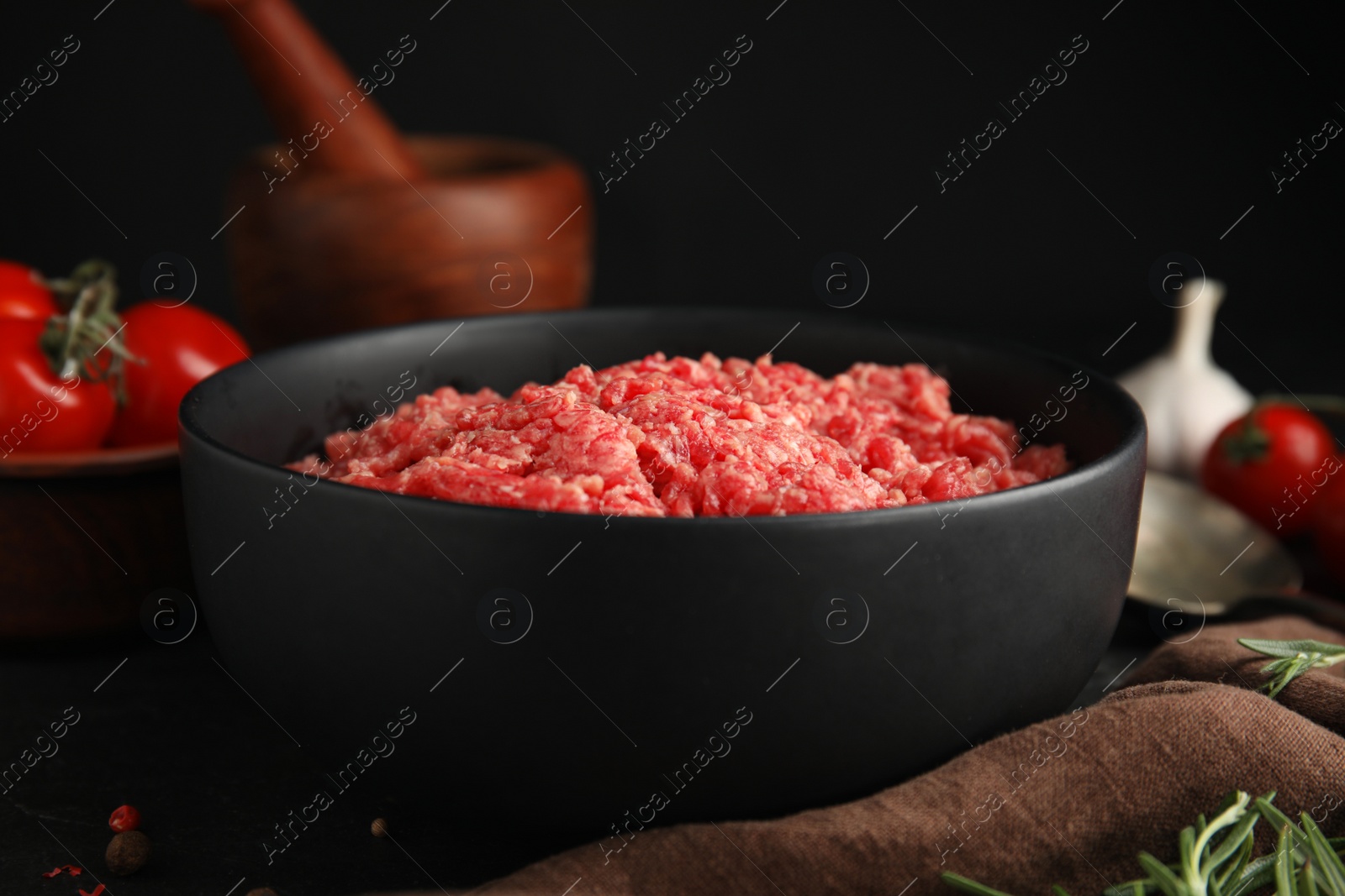 Photo of Fresh minced meat in bowl on table, closeup