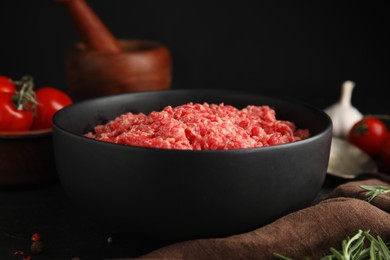 Photo of Fresh minced meat in bowl on table, closeup