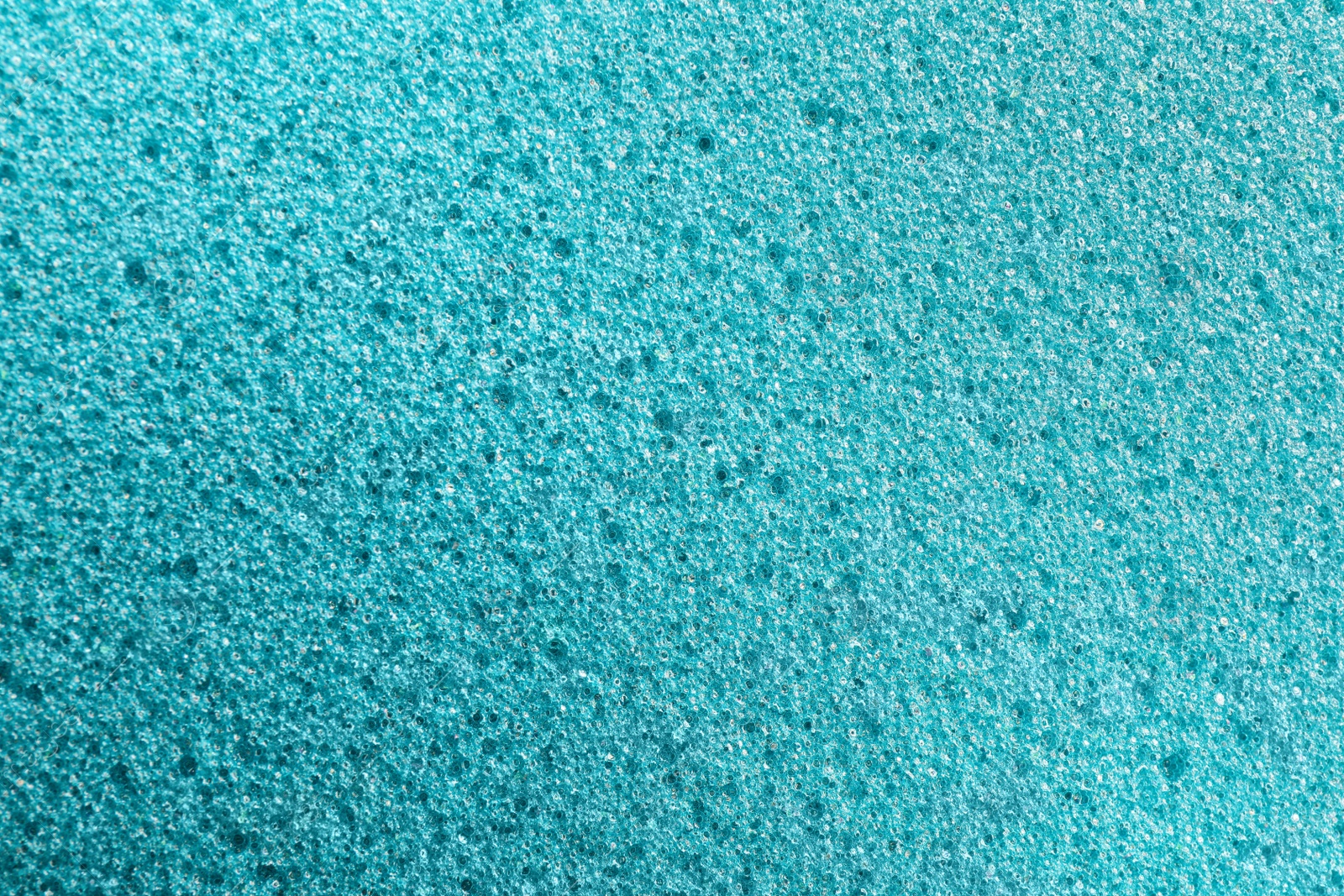 Photo of Texture of light blue pumice stone as background, closeup