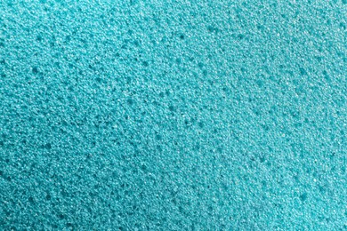 Photo of Texture of light blue pumice stone as background, closeup