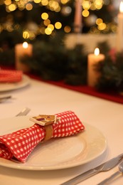 Luxury place setting with beautiful festive decor for Christmas dinner on white table, closeup