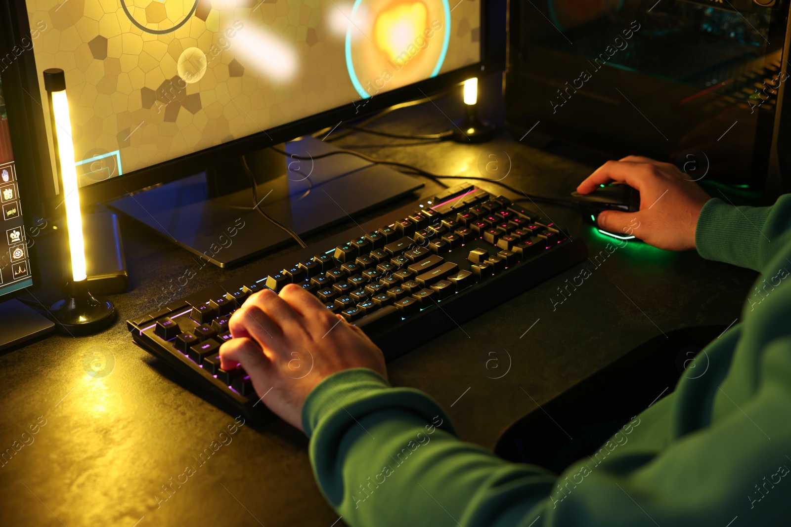 Photo of Man playing video games on computer indoors, closeup