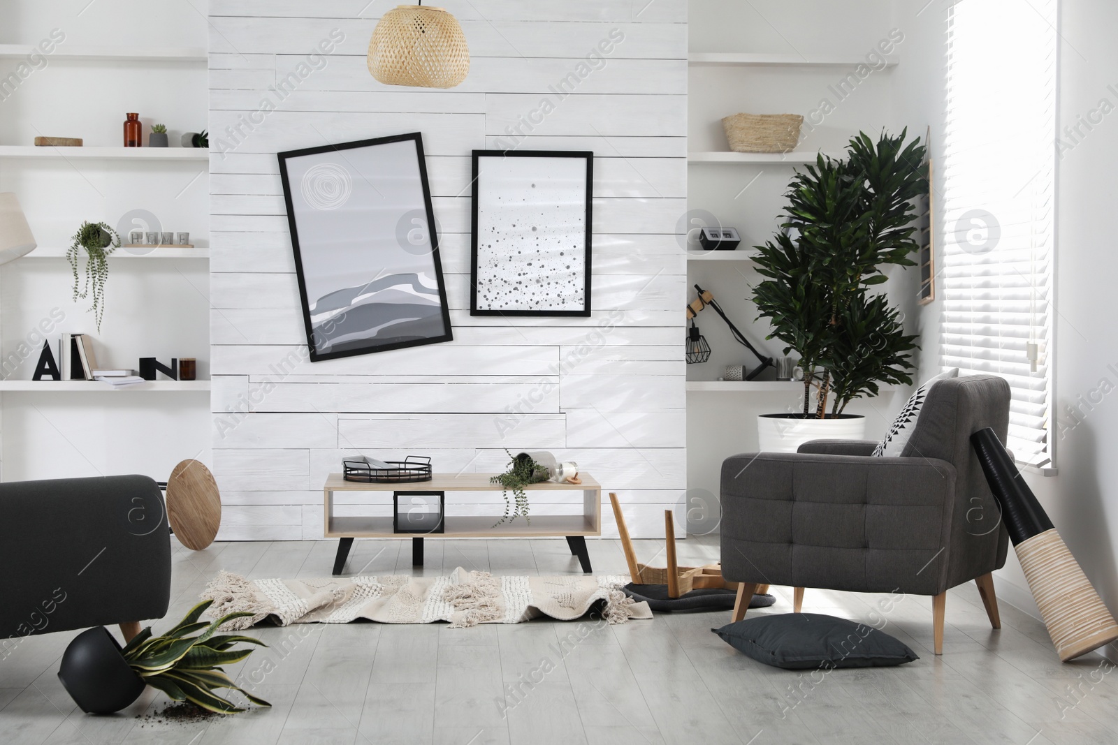 Photo of Chaotic living room interior after strong earthquake