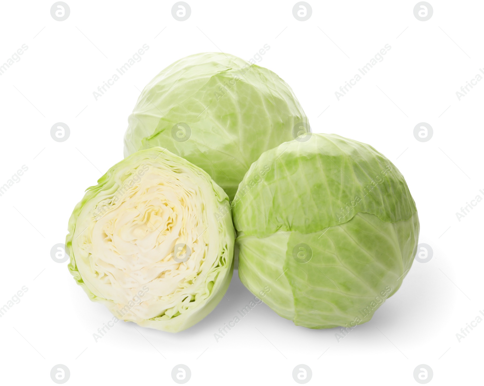 Photo of Whole and cut fresh ripe cabbages on white background