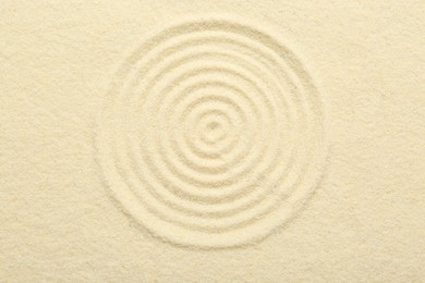 Zen rock garden. Circle pattern on beige sand, top view