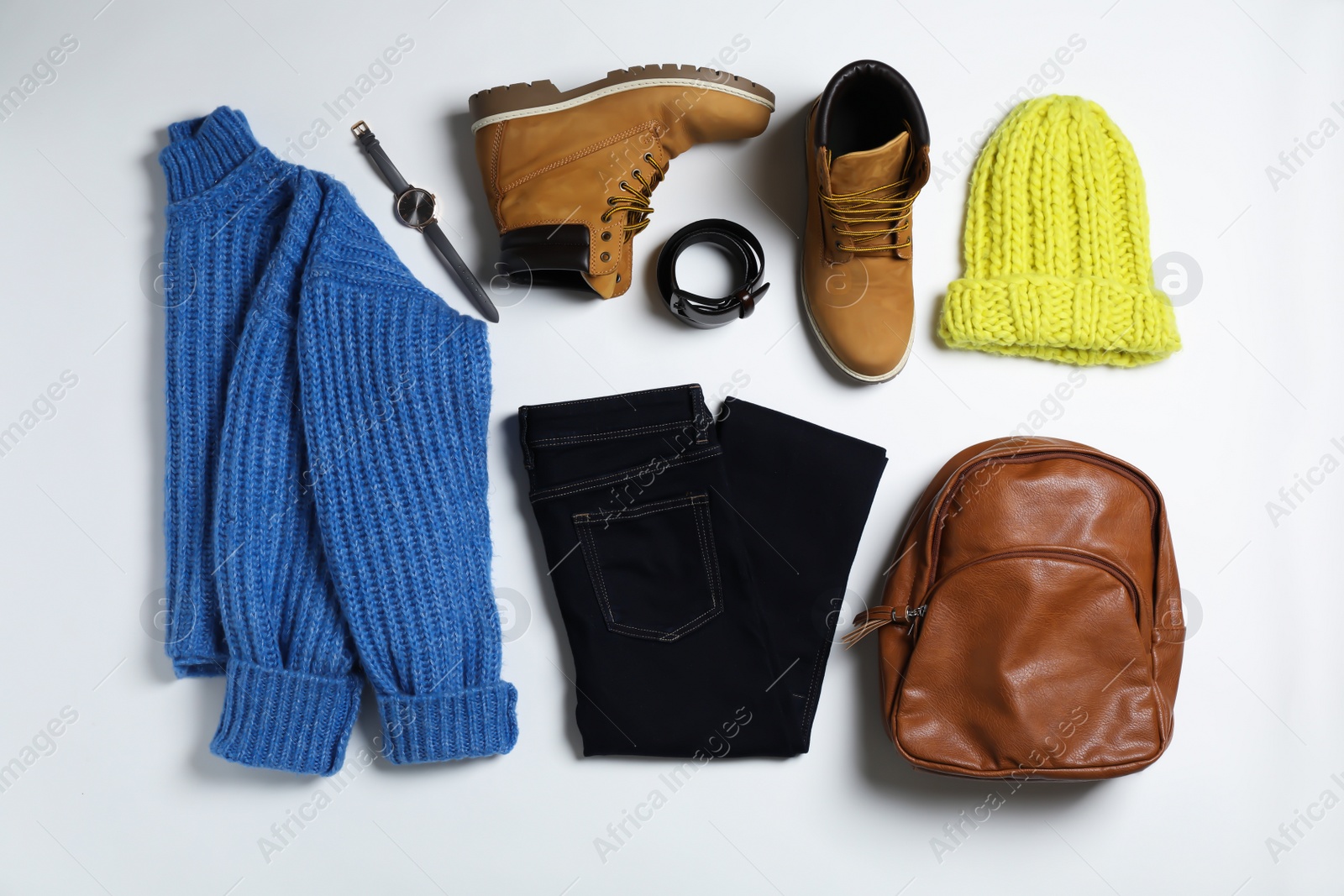 Photo of Flat lay composition with female winter clothes on white background