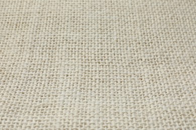 Texture of beige fabric as background, closeup