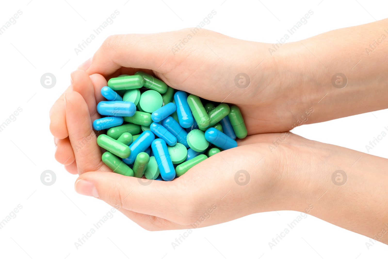 Photo of Woman holding color pills on white background, closeup