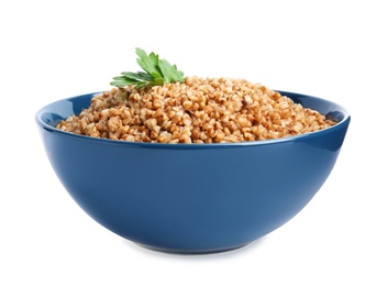 Bowl of buckwheat porridge with parsley isolated on white