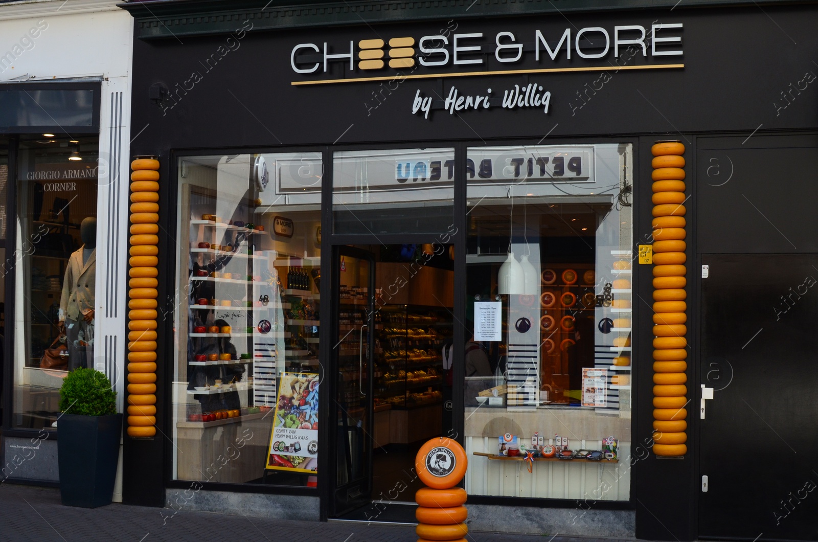 Photo of Hague, Netherlands - May 2, 2022: Exterior of Cheese & More dairy store on city street