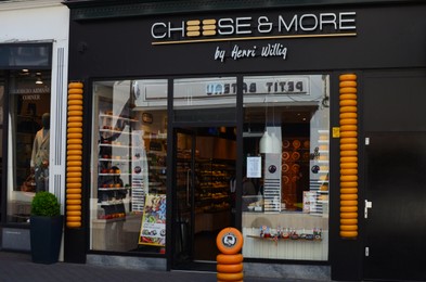 Photo of Hague, Netherlands - May 2, 2022: Exterior of Cheese & More dairy store on city street