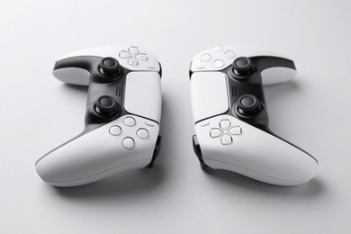 Wireless game controllers on light grey background