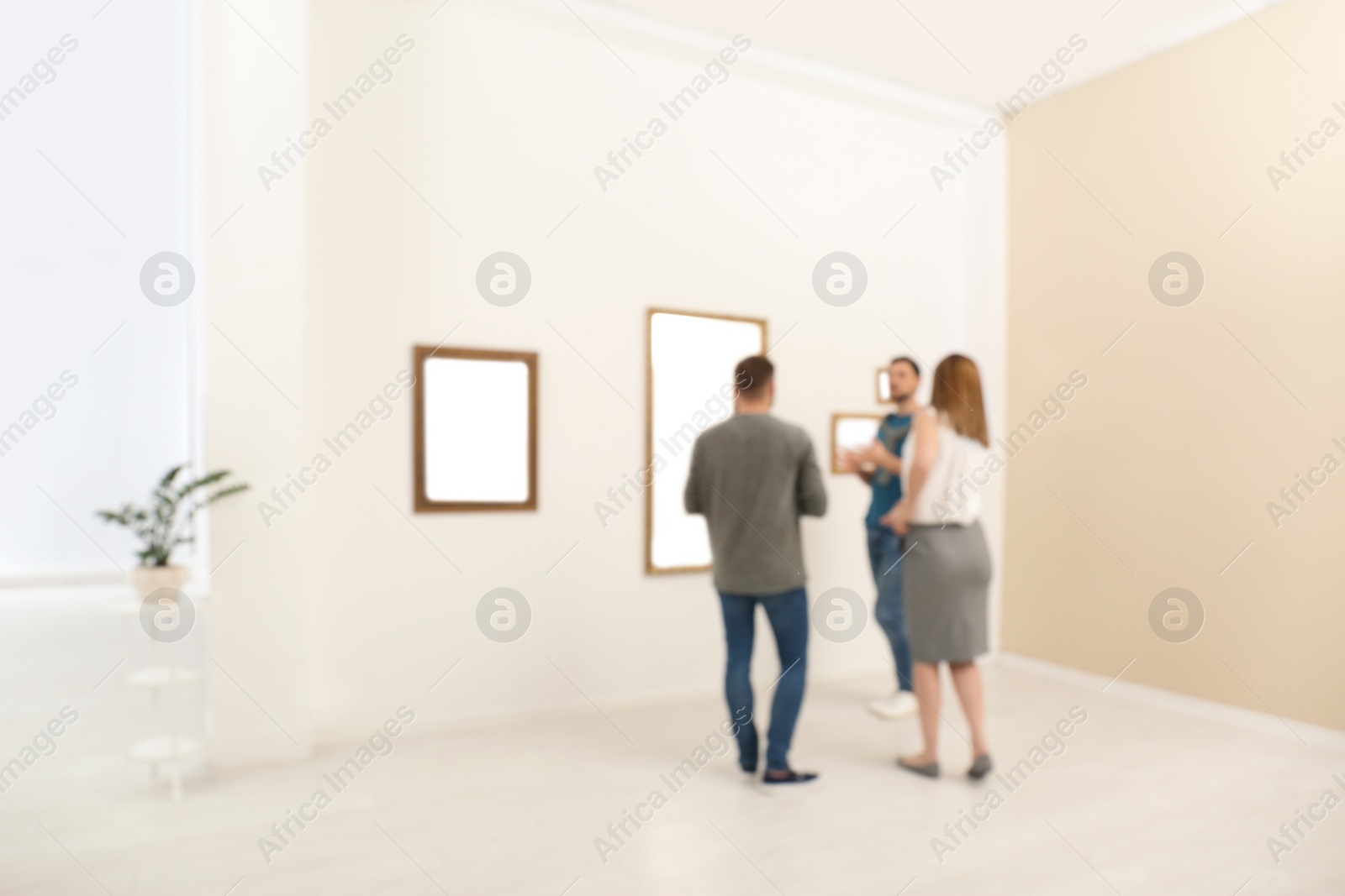 Photo of People in modern art gallery, blurred view