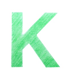 Photo of Letter K written with green pencil on white background, top view