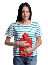 Photo of Woman using hot water bottle to relieve abdominal pain on white background