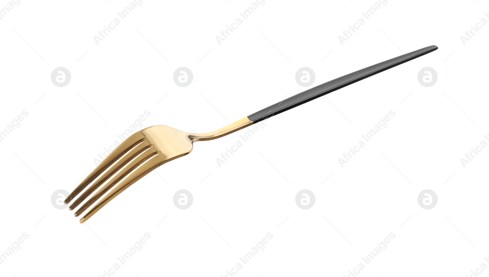 Photo of One shiny golden fork isolated on white