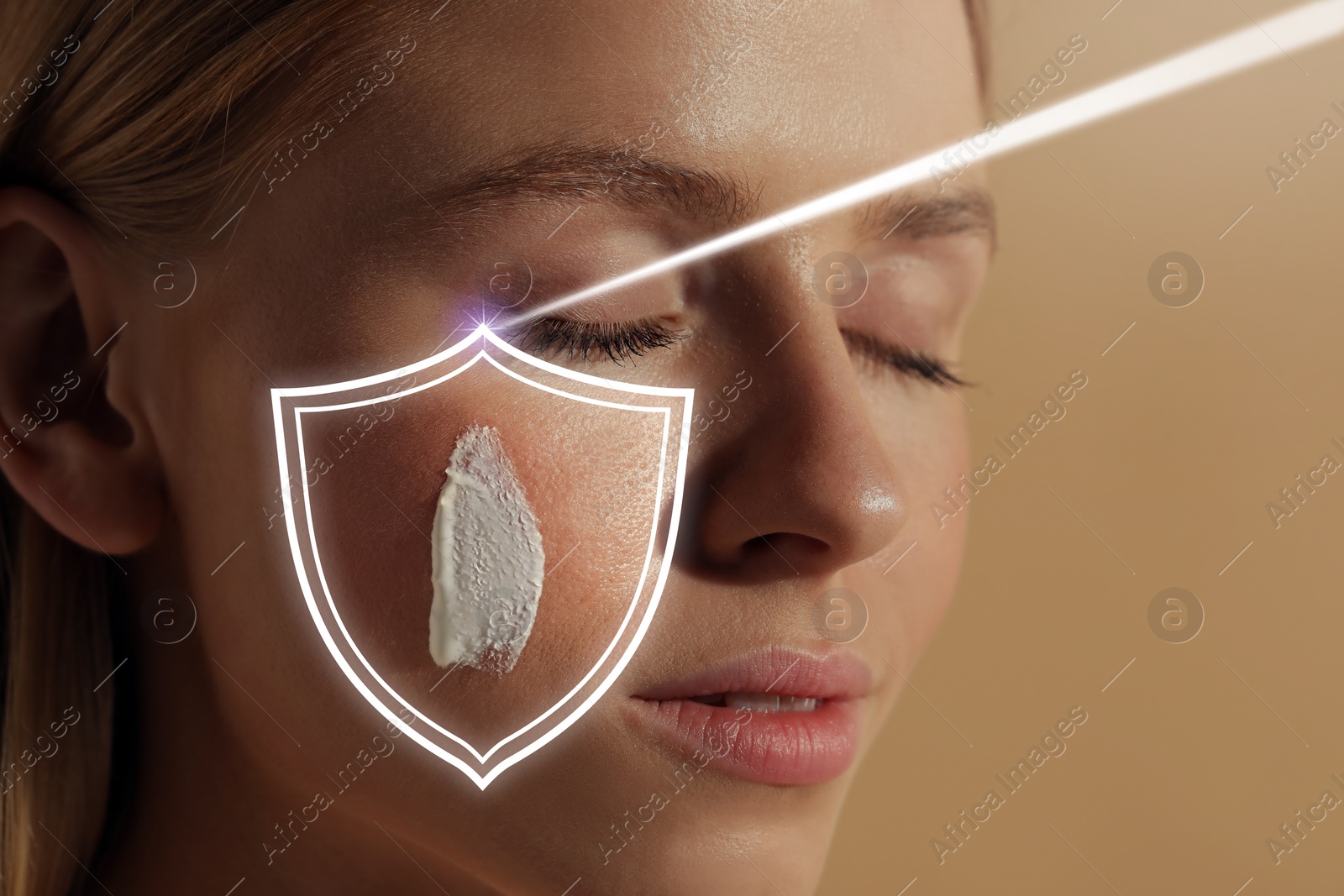 Image of Sun protection care. Beautiful woman with sunscreen on face against beige background, space for text. Illustration of shield as SPF
