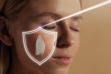 Sun protection care. Beautiful woman with sunscreen on face against beige background, space for text. Illustration of shield as SPF