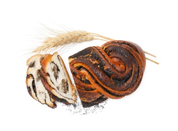 Photo of Cut poppy seed roll and spikelets isolated on white, top view. Tasty cake