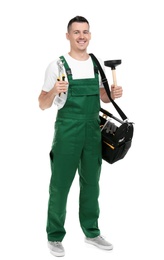 Young plumber with tool bag on white background