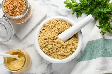 Photo of Flat lay composition with mortar and aromatic mustard powder on white marble table