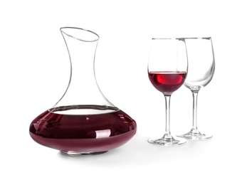 Elegant decanter with red wine and glasses on white background