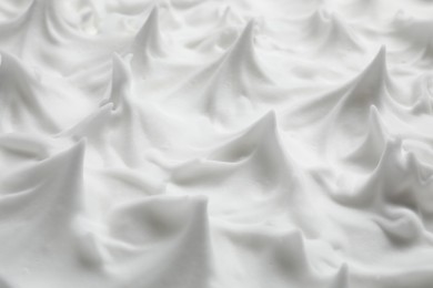 Photo of Texture of white shaving foam as background, closeup